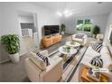 Bright living room with modern furnishings, large windows, and neutral tones at 4504 Cedar Ridge Trl, Stone Mountain, GA 30083