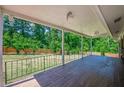 Spacious covered patio with wood flooring, perfect for outdoor entertaining and relaxation at 2133 Bird Ln, Snellville, GA 30078