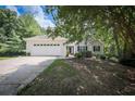 Inviting single-story home with a large garage and a well-maintained front lawn and established trees at 239 Clear Brook Trl, Douglasville, GA 30134