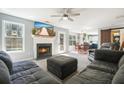Cozy living room with a fireplace, comfortable seating, and open access to the dining area at 537 Autumn Ridge Dr, Canton, GA 30115