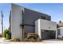 Contemporary two-story home with a grey and white color scheme, and an attached garage at 53 Daniel Se St, Atlanta, GA 30312
