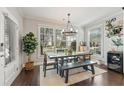 Dining room with large windows, stylish chandelier, and elegant table setting at 1338 Dupont Nw Park, Atlanta, GA 30318