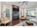 Bright living room featuring a fireplace, large windows, and hardwood flooring at 1338 Dupont Nw Park, Atlanta, GA 30318