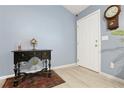 Inviting entryway features stylish wood floors, a decorative table, and a classic regulator clock adding charm at 39 Cannon Pl, Dallas, GA 30157