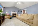 Spacious living room with vaulted ceilings, a cozy fireplace, and ample seating, perfect for relaxation at 39 Cannon Pl, Dallas, GA 30157