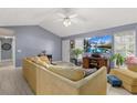 Bright living room boasts a large TV, comfortable seating, and natural light, creating a relaxing ambiance at 39 Cannon Pl, Dallas, GA 30157