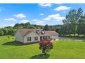 Beautiful house with a large front yard, mature trees and a well manicured lawn at 24 Fossetts Nw Cv, Cartersville, GA 30121