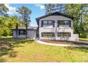 Charming two-story home with painted brick, black shutters, and a well-manicured lawn at 2158 Oregon Ct, Decatur, GA 30032