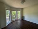 Bright bedroom featuring a bay window and hardwood floors at 1100 Whistle Dr, Austell, GA 30106