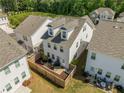 Backyard aerial view featuring a fenced-in patio area and a well-maintained lawn at 3723 Silvery Way, Powder Springs, GA 30127