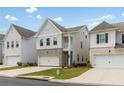 Modern three-story home with brick facade and attached garage at 3723 Silvery Way, Powder Springs, GA 30127