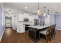 Open kitchen with island and modern appliances at 3723 Silvery Way, Powder Springs, GA 30127