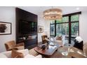 An interior shot reveals a modern living room with a fireplace, plush seating, and a large window at 721 Longleaf Ne Dr # 3, Atlanta, GA 30342