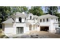 New construction featuring an exterior elevation with white painted brick and a light grey roof at 9675 Almaviva Dr, Alpharetta, GA 30022