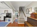 Inviting foyer with hardwood floors, staircase, and access to the living room and dining area at 62 Mount Vernon Cir, Atlanta, GA 30338