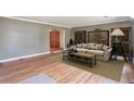 Comfortable living room featuring stylish furniture, wood floors, and ample natural light at 1282 Berryhill Dr, Lithonia, GA 30058