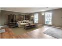 Bright and airy living room with two windows, a cozy couch, and stylish decor at 1282 Berryhill Dr, Lithonia, GA 30058