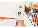 Bright entryway with hardwood floors and staircase leading to an office space at 1996 Cobblestone Ne Cir, Atlanta, GA 30319