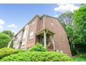 Beautiful brick townhome with a front porch and well-maintained landscaping at 1996 Cobblestone Ne Cir, Atlanta, GA 30319