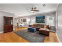 Spacious living room with hardwood floors, ample natural light, and stylish furnishings adjacent to the kitchen at 2486 Memorial Se Dr, Atlanta, GA 30317