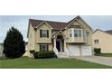 Traditional two-story home features a two-car garage, brick-accented entrance, manicured lawn and decorative trim work at 51 Freedom Ne Dr, Cartersville, GA 30121