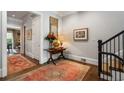Traditional foyer featuring hardwood floors, elegant decor, and access to other rooms in the home at 122 Old Ivy Ne Rd # 17, Atlanta, GA 30342