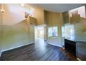 Spacious living room showcasing tall ceilings, fireplace, and modern floors at 1606 Parkaire Xing # 1606, Marietta, GA 30068