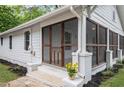 Lovely home with a spacious screened-in porch and landscaped front yard at 1591 Jonesboro Se Rd, Atlanta, GA 30315
