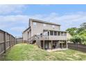 Spacious backyard featuring a wooden deck, screened-in porch, and lower-level patio perfect for entertaining at 13 Cottage Nw Walk, Cartersville, GA 30121