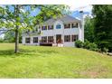 Two-story home featuring a white exterior, wood shutters, a chimney and a well-maintained front lawn at 17 Hiram Way, Hiram, GA 30141