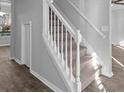 Bright staircase with white railings and carpeted steps in a modern home at 194 Beaverwood Ct, Lawrenceville, GA 30044