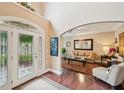 Inviting foyer with high ceilings, hardwood floors, and an open view to the living room at 4590 Hastings Dr, Cumming, GA 30041