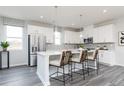 Modern kitchen with white cabinetry, stainless steel appliances, and a large center island at 2719 Stream Valley Lane Nw Nw Cir, Atlanta, GA 30318