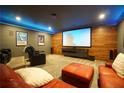 Cozy media room with large screen, comfortable seating, and ambient lighting at 3235 Munsey Ct, Cumming, GA 30041
