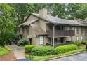 Charming condo with a private balcony surrounded by mature trees at 1301 Cumberland Se Ct, Smyrna, GA 30080