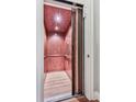 Interior view of elevator with wood paneling and lighting at 5605 Waters Edge Trl, Roswell, GA 30075