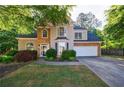 Charming two-story home with stone accents, manicured landscaping, and a welcoming front entrance at 2687 Mountain Oaks Ct, Powder Springs, GA 30127