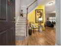Welcoming foyer with hardwood floors and staircase leading to the upper level at 2000 Suttles Sw Dr, Atlanta, GA 30331