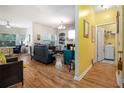 Open-concept living room with hardwood floors and bright, cheery accents at 2000 Suttles Sw Dr, Atlanta, GA 30331