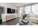 Contemporary living room with stylish furnishings, modern decor, and natural light from the door at 2670 Brookview Nw Ln, Atlanta, GA 30318