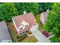 Aerial view of a home with mature trees and a long driveway at 2725 Sedgeview Way, Buford, GA 30519