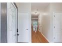 Bright foyer with hardwood floors, white trim, and a view into the living spaces at 2725 Sedgeview Way, Buford, GA 30519