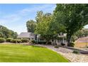 Lovely front yard with lush green grass and mature trees, providing a serene and picturesque setting at 2790 Shiloh Way, Snellville, GA 30039