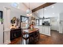 Cozy dining area with wooden table, decorative lighting, and open access to the kitchen at 1314 Arkwright Se Pl, Atlanta, GA 30317