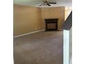 Spacious living room featuring carpet and a fireplace at 4752 Browns Mill Ferry Rd, Lithonia, GA 30038