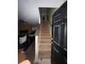 View of the staircase leading to the upper level of the home at 4752 Browns Mill Ferry Rd, Lithonia, GA 30038