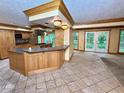 Spacious kitchen with a center island, tile floors, and modern appliances at 5346 Light Cir, Norcross, GA 30071