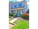 Attractive two-story home with a welcoming front porch, and tidy landscaping, complemented by blue shutters at 10900 Wittenridge Dr # L6, Alpharetta, GA 30022