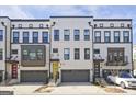 Modern townhomes with colorful front doors and a well maintained landscaped yard at 1149 Ansel Nw Ln, Atlanta, GA 30318