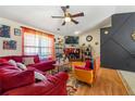 Cozy living room with a brick fireplace, warm lighting, and comfortable seating, creating a welcoming atmosphere at 120 Aspen Forest Dr, Covington, GA 30016